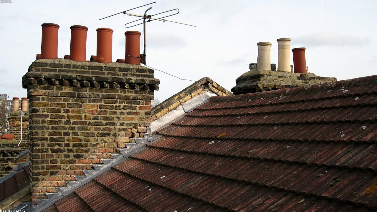 Chimney flashing detail on an asphalt shingle roof in South Euclid, OH